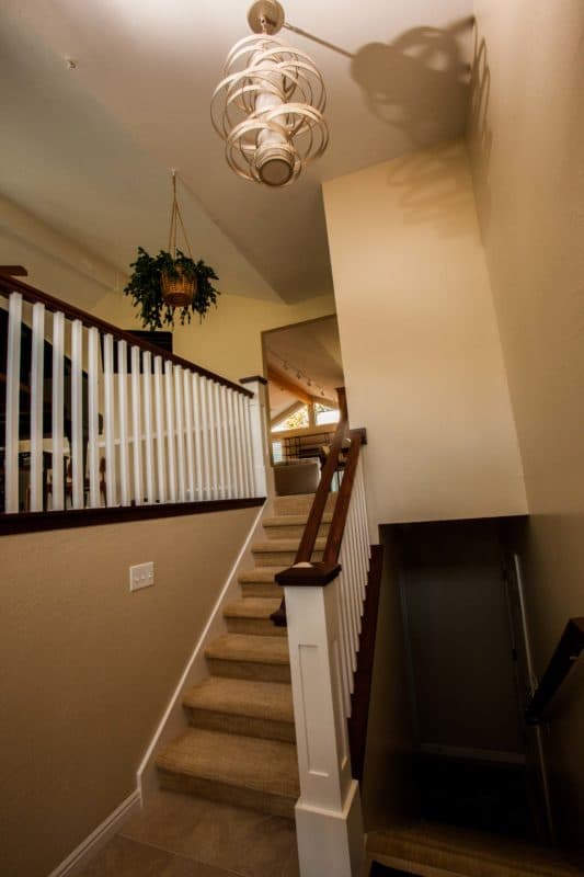 view of stairway with white and wood banisters.