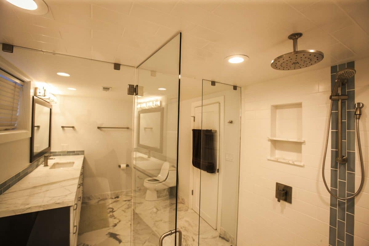 view from inside the shower room, see vanity on the left and toilet on far right