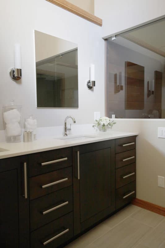 bathroom with large mirrors and double sinks.