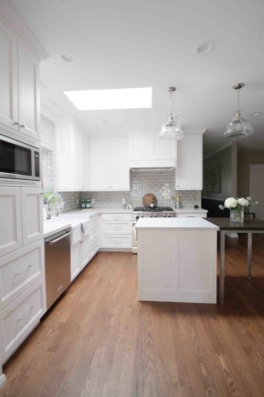 white kitchen with white island
