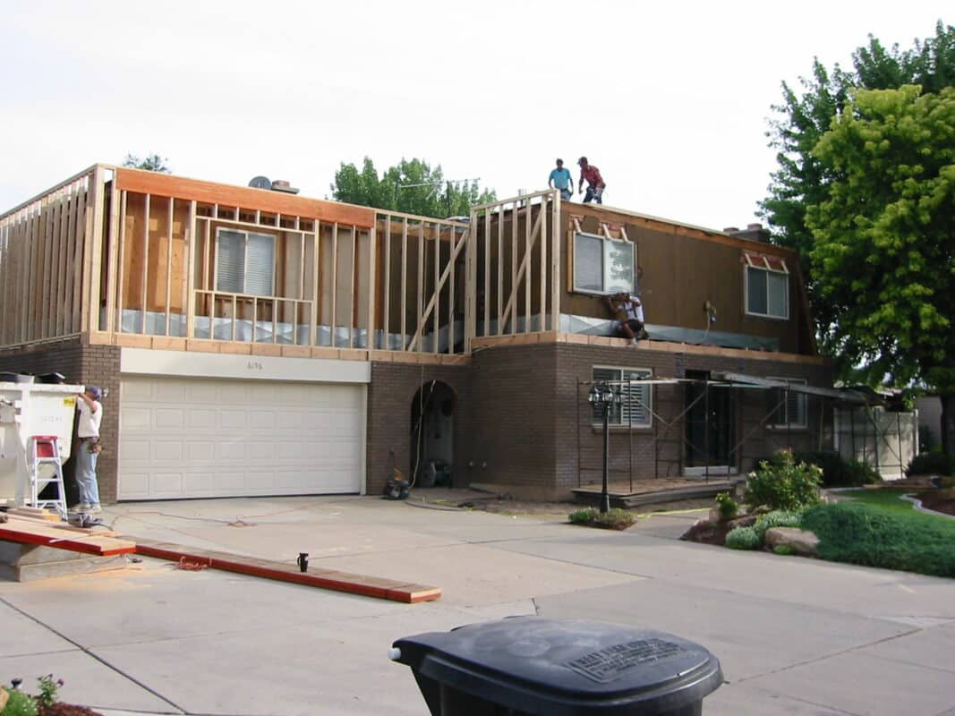 exterior remodel showing upstairs framing on house