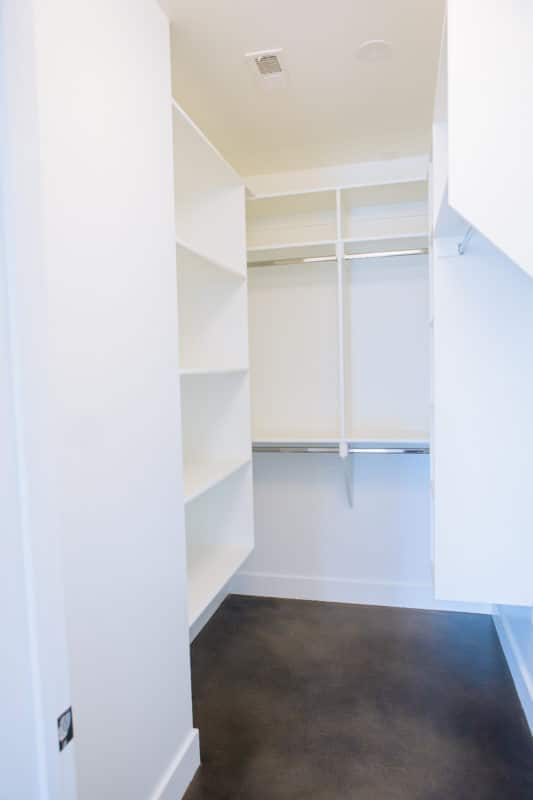 closet organizers in basement closet of luxury new home build