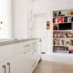 white gloss cabinets stainless pulls, book shelf