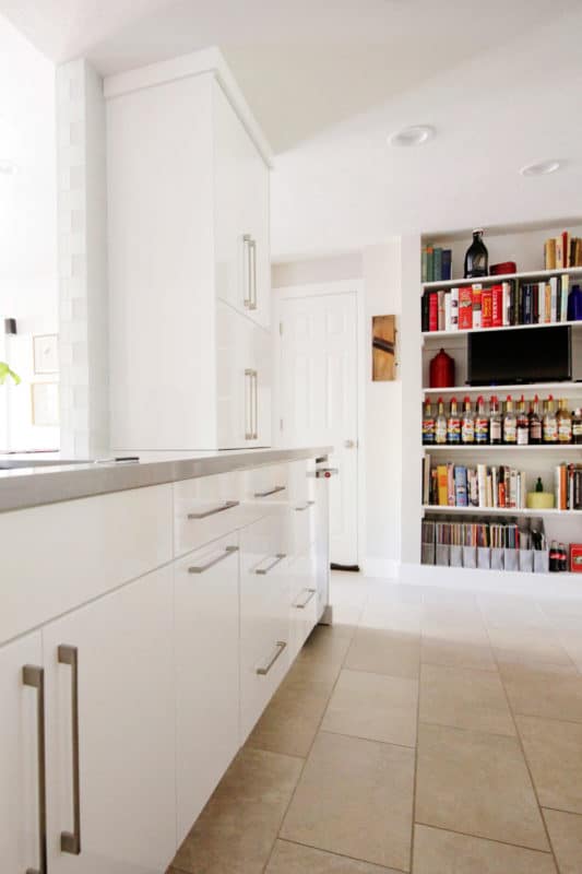 white gloss cabinets stainless pulls, book shelf