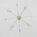 light fixture with 8 spokes and bulb lights on the ends
