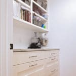 white cabinets and shelves in butlers pantry