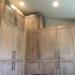 High-end custom natural wood floor to ceiling cabinets by Fine Remodel